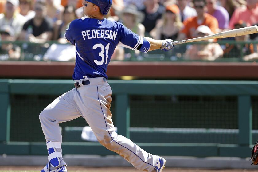 Dodgers outfielder Joc Pederson hits a third inning home run against Giants pitcher Matt Cain in a spring training game Sunday.