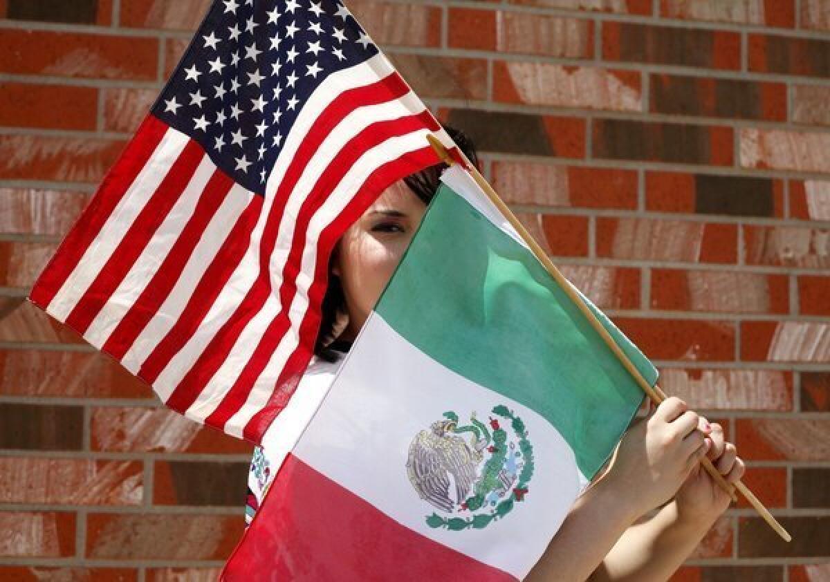 The U.S. Senate passed a bipartisan immigration bill that has moved to the GOP-controlled House. Above: An undocumented immigrant poses for a portrait with the American and Mexican flags in Odessa, Texas.