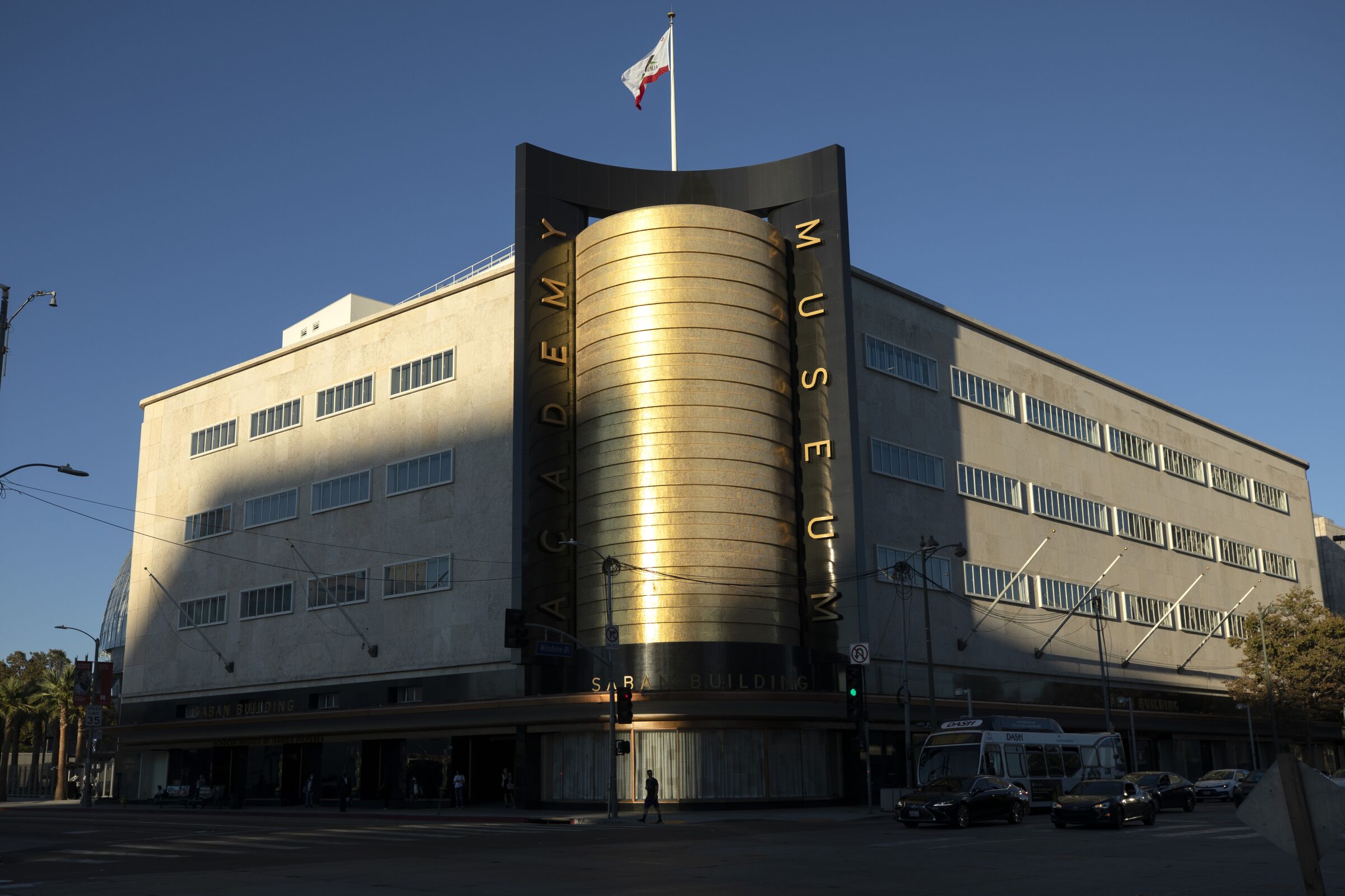 The Academy Museum of Motion Pictures' gold-tiled corner glimmers in the afternoon sun.