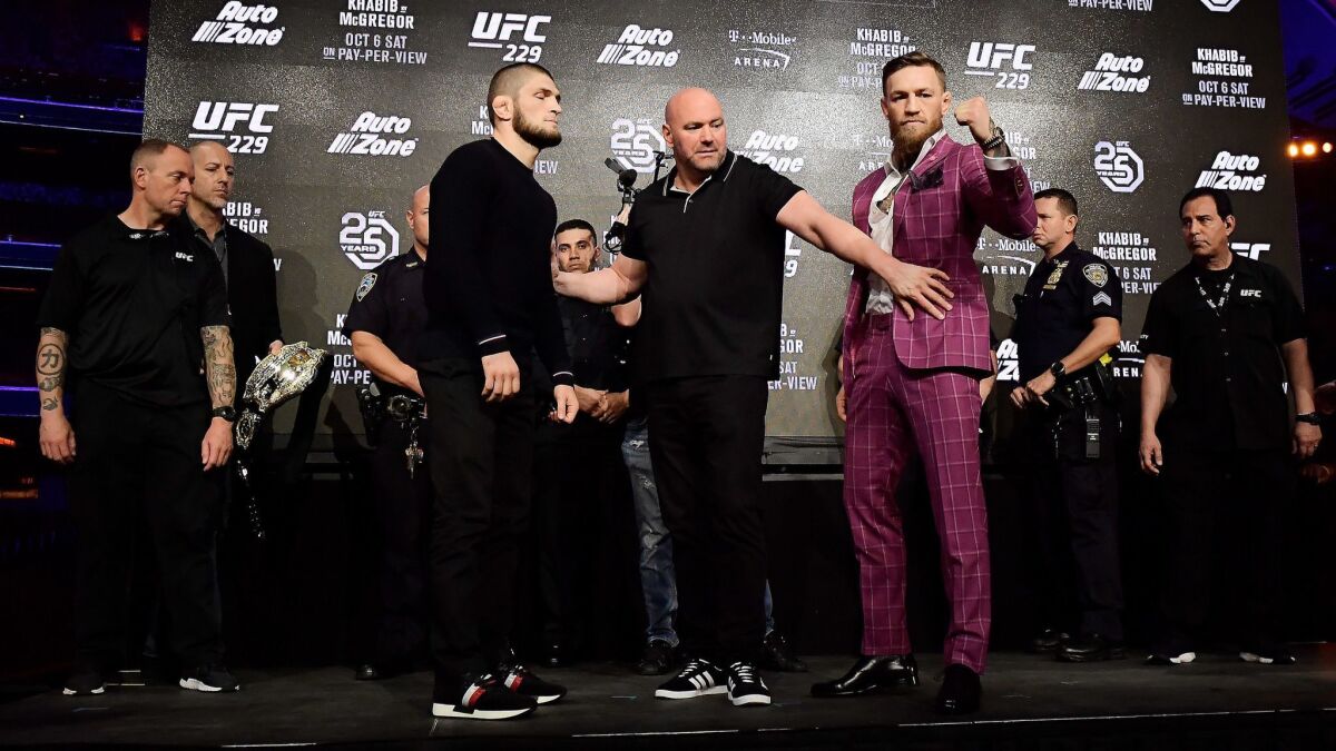 Lightweight champion Khabib Nurmagomedov faces off with Conor McGregor during the UFC 229 press conference on Sept. 20.
