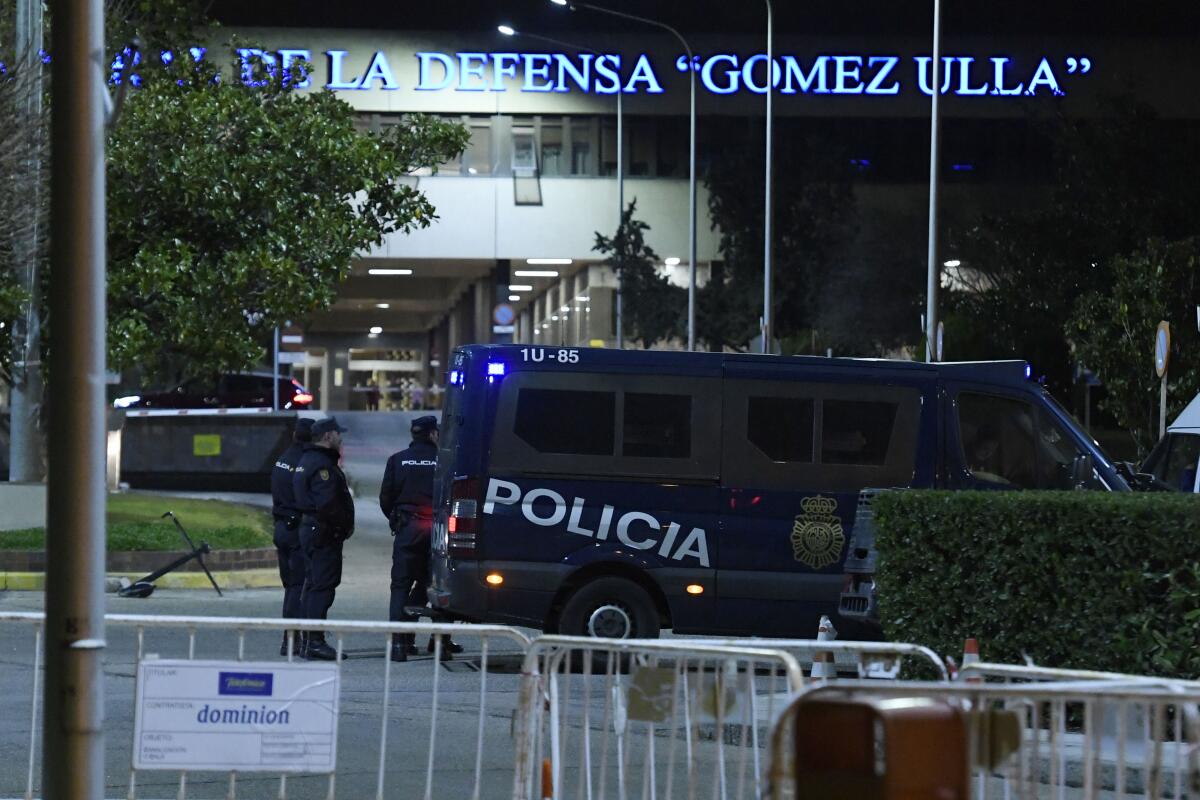 Police officers stand outside the Gomez Ulla Military Hospital in Madrid after the arrival of the 19 Spanish nationals evacuated from the Chinese city of Wuhan, amid the novel coronavirus outbreak, to be put in quarantine on January 31, 2020. - A charter plane carrying 25 evacuees from the Chinese city at the centre of the deadly novel coronavirus outbreak, arrived at the Torrejon-Madrid joint civil-military airport today. (Photo by OSCAR DEL POZO / AFP) (Photo by OSCAR DEL POZO/AFP via Getty Images) ** OUTS - ELSENT, FPG, CM - OUTS * NM, PH, VA if sourced by CT, LA or MoD **