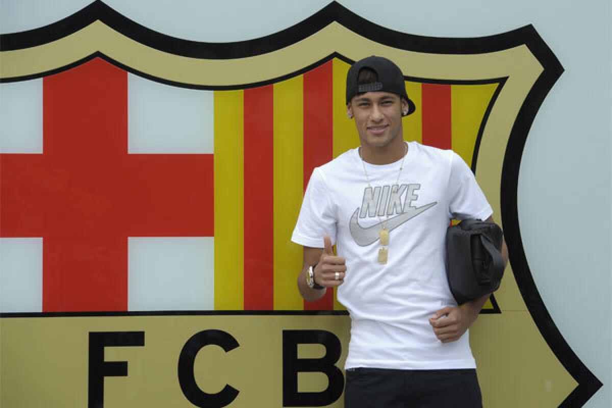 FC Barcelona's then-new signing Neymar arrives at the club's office at the Camp Nou stadium last June.