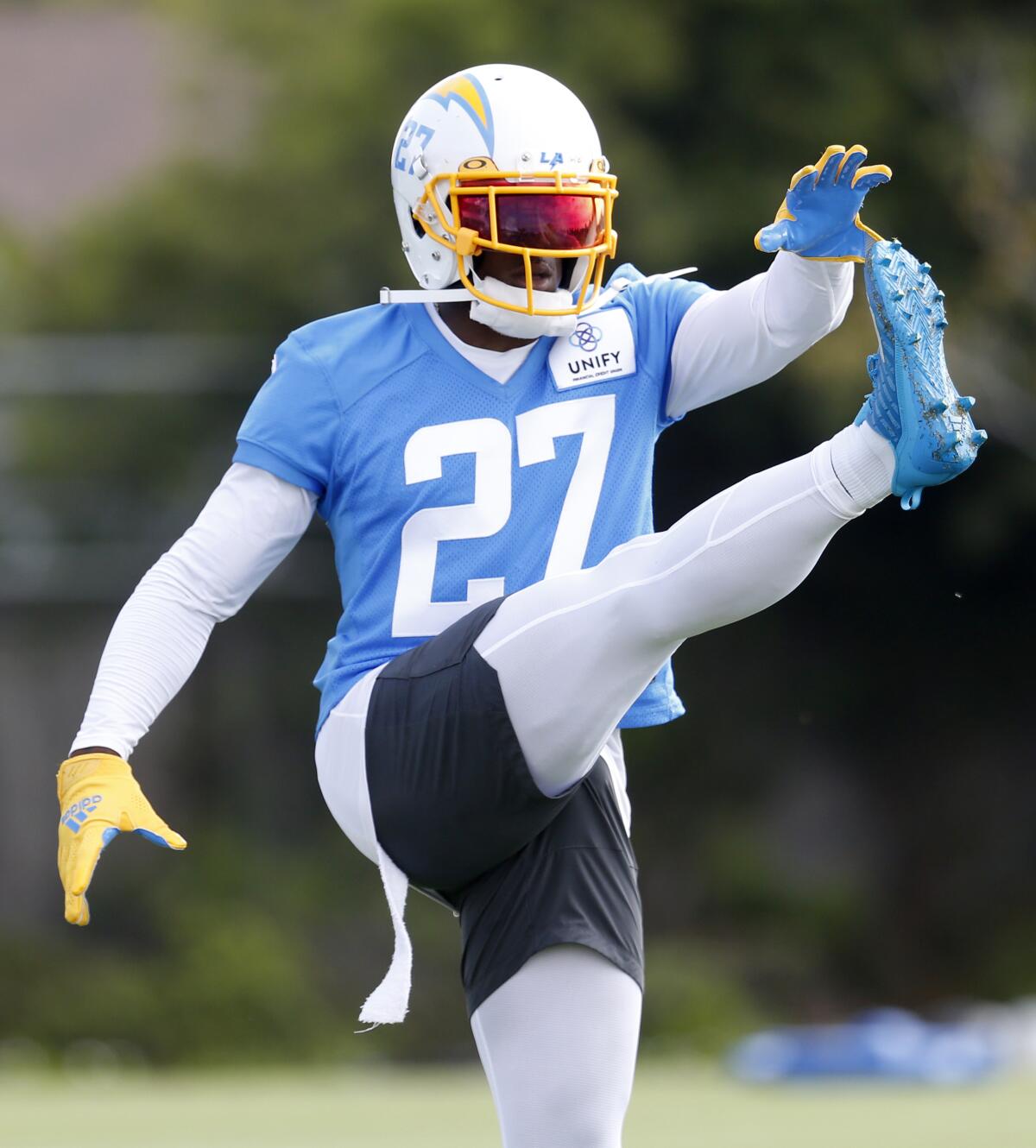 Chargers cornerback J.C. Jackson loosens up ahead of practice.