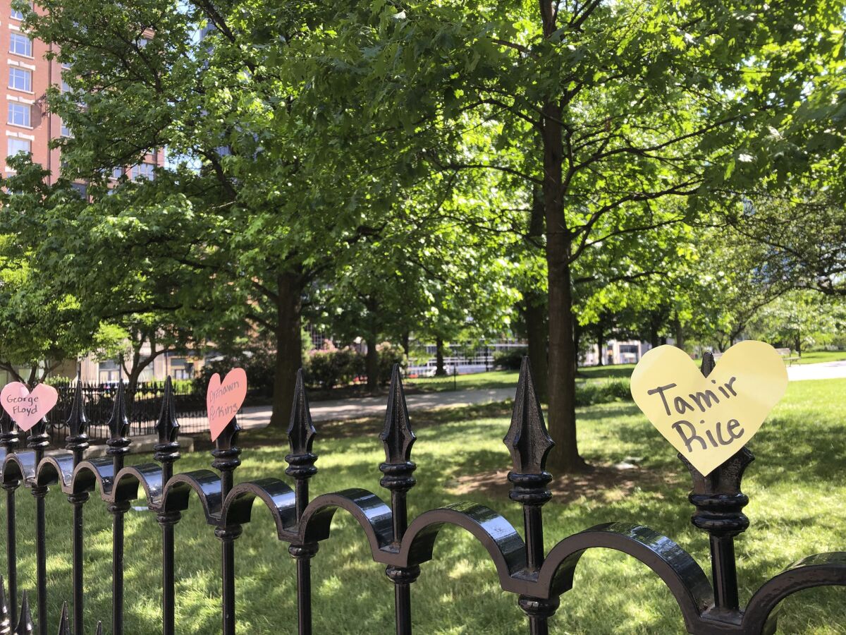 Hearts with the names of black people who died at the hands of police are displayed on a fence as part of a protest at the Ohio Statehouse in Columbus, Ohio, on Saturday, June 6, 2020. People are protesting racial injustice and police brutality after the death of George Floyd, a black man, who died after he was restrained by Minneapolis police on May 25. (AP Photo/Julie Carr Smyth)