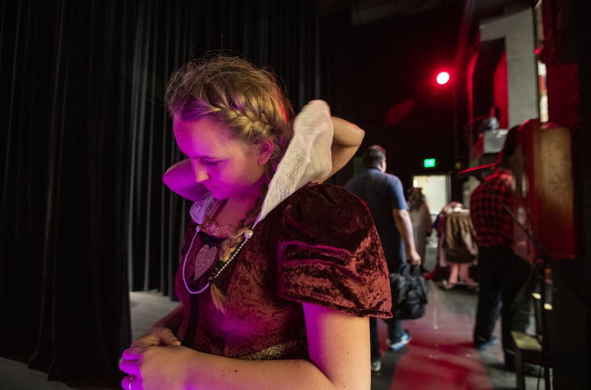 Taylor McDannold, 14, gets ready for her role as the Queen of Hearts during Monday's rehearsal.