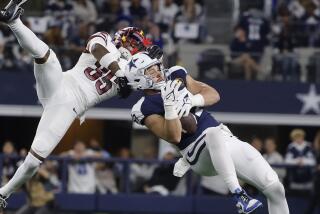 Dallas Cowboys tight end Jake Ferguson, right, cannot catch a pass while being defended by Washington Commanders safety Percy Butler (35) during the second half of an NFL football game Thursday, Nov. 23, 2023, in Arlington, Texas. (AP Photo/Michael Ainsworth)