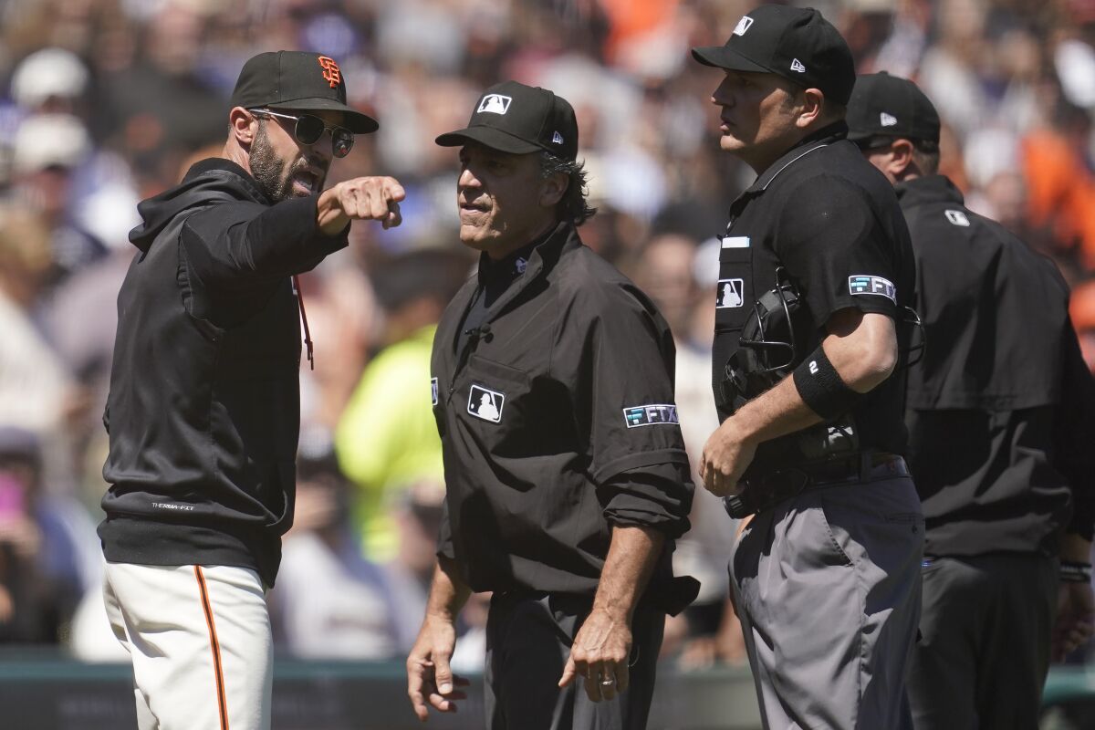 San Francisco Giants manager Gabe Kapler argues with umpire Phil Cuzzi.