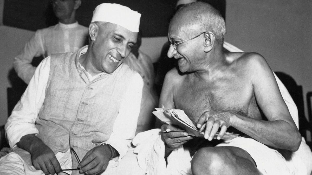Max Desfor worked for a time in India, where he took this photo of Mahatma Gandhi and Jawaharlal Nehru, left, who would become India's first prime minister.