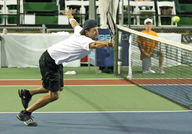 The Newport Beach Breakers' Lester Cook rushes the net against the Washington Kastles.