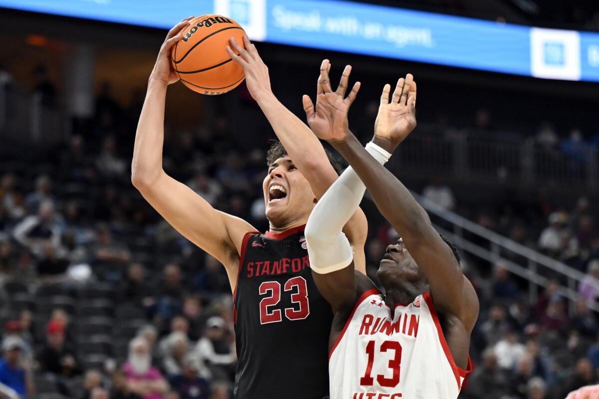 Stanford forward Brandon Angel shoots against Utah center Keba Keita.