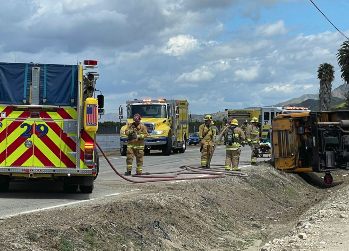 Ventura County Fire Department units are on the scene of a school bus roll.