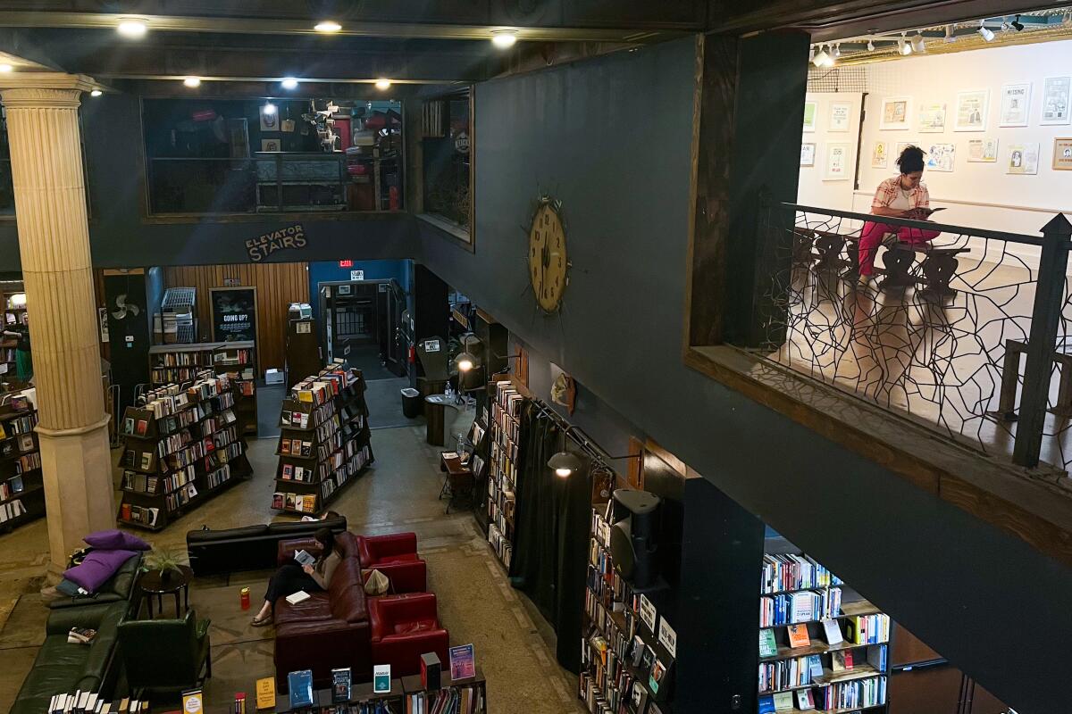 People read upstairs and down at the Last Bookstore downtown.