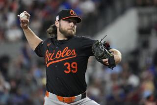 Baltimore Orioles starting pitcher Corbin Burnes throws during the first inning of a baseball game against the Texas Rangers in Arlington, Texas, Friday, July 19, 2024. (AP Photo/LM Otero)