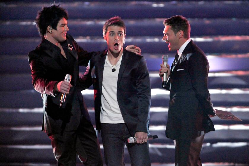 Adam Lambert, left, is runner-up to Kris Allen on “American Idol” in 2009, and host Ryan Seacrest witnesses the victory. Fox executives say next season will be the last for “Idol,” once a ratings titan.