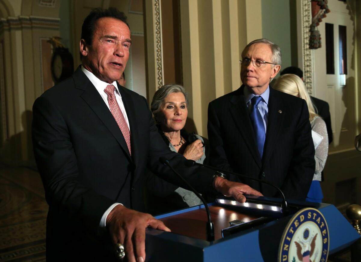 Former California Gov. Arnold Schwarzenegger at a Capitol Hill news conference with Sen. Barbara Boxer (D-Calif.) and Senate Majority Leader Harry Reid (D-Nev.).
