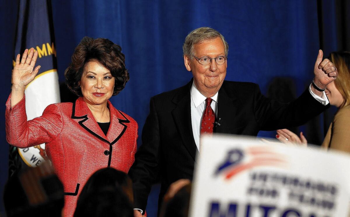 Senate Republican leader Mitch McConnell and his wife, Elaine Chao, celebrate his primary victory in Louisville, Ky.