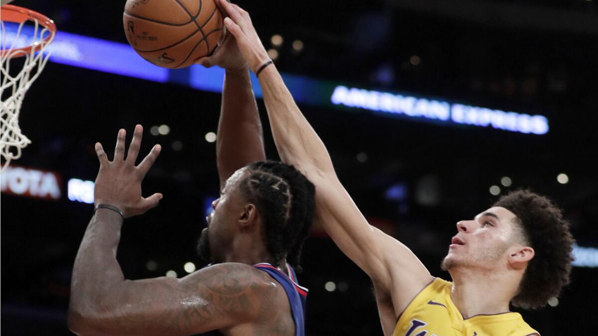 Lakers guard Lonzo Ball blocks the shot of Clippers center DeAndre Jordan during second half Thursday.