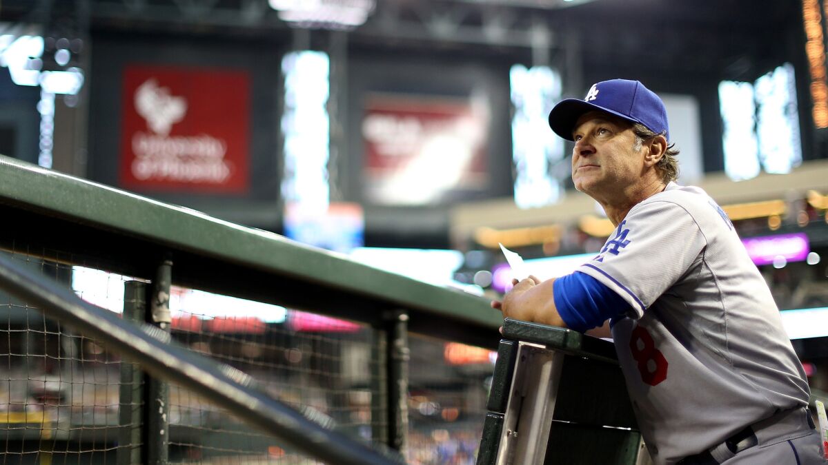 Dodgers Manager Don Mattingly watches from the dugout during a game against the Arizona Diamondbacks on May 16.