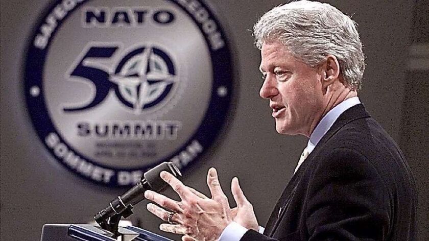 Then-President Bill Clinton speaks at the NATO 50th anniversary summit in Washington on April 25, 1999.