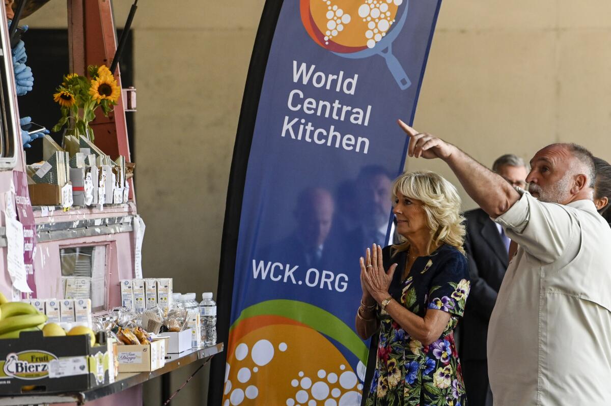 FILE - First lady Jill Biden and Spanish chef Jose Andres of the World Central Kitchen greet volunteers from the World Central Kitchen association during a visit to a reception center for Ukrainian refugees in Madrid, Spain, Tuesday, June 28, 2022. Donations from Fidelity Charitable climbed 11% to a record $4.8 billion for the first half of 2022, the nation’s largest grantmaker announced Wednesday, July 20, 2022. Emergency relief organization International Medical Corps saw the number of Fidelity Charitable donors provide them a grant jump more than 1,000% compared to the first half of 2021, while World Central Kitchen grew more than 500%. (Oscar del Pozo/Pool Photo via AP, File)