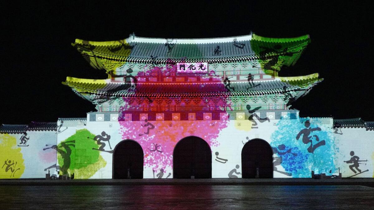 Olympic figures are projected on the Gwanghwamun Gate in Seoul. The 2018 Winter Games will be held in PyeonChang, South Korea.