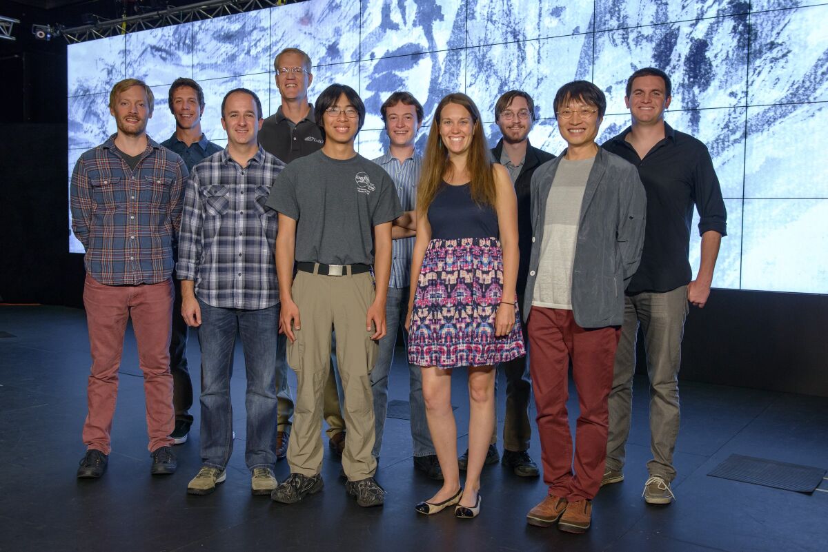 Composer Lei Liang (second from right) is shown a few years ago with his team at the California Institute for Telecommunications and Information Technology, which is now known as Qualcomm Institute. He credits the team for making key contributions to an electronic music composition of his eventually became his award-winning orchestral work, "A Thousand Mountains, A Million Streams." From left are Greg Surges, Eric Hamdan, Zachary Seldess, Falko Kuester, Eric Lo, James Strawson, Samantha Stout, Chris McFarland, Liang and John Mangan.