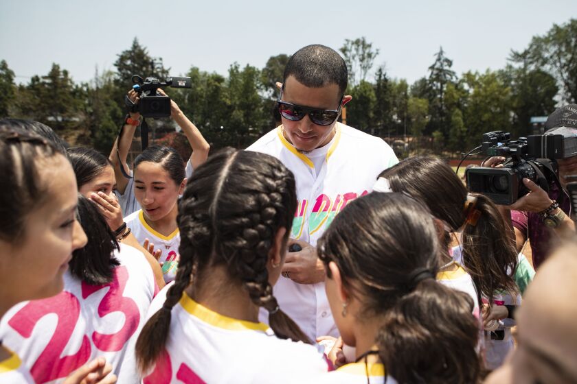 Mexcio City - April 28: Padres' Manny Machado is surrounded by fans and local media as the team puts on a kids clinic at Liga Infantil de Beisbol Olmeca A.C on Friday, April 28, 2023 in Mexcio City. (Meg McLaughlin / The San Diego Union-Tribune)