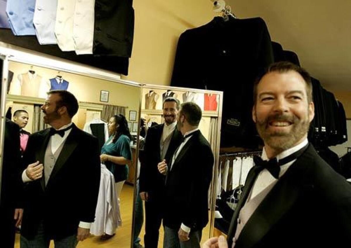 Paul Waters, right, and his partner Kevin Voecks check the fit of their tuxedos for their wedding Tuesday, June 17, 2008. Assemblyman Mike Feuer (D- Los Angeles) will officiate the ceremony in a Studio City corporate office garden.