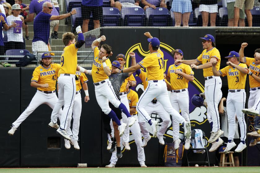 FILE - East Carolina celebrates after a home run hit by Ryan McCrystal (9) during an NCAA regional baseball game against Evansville on Sunday, June 2, 2024, in Greenville, N.C. (AP Photo/Ben McKeown, FIle)
