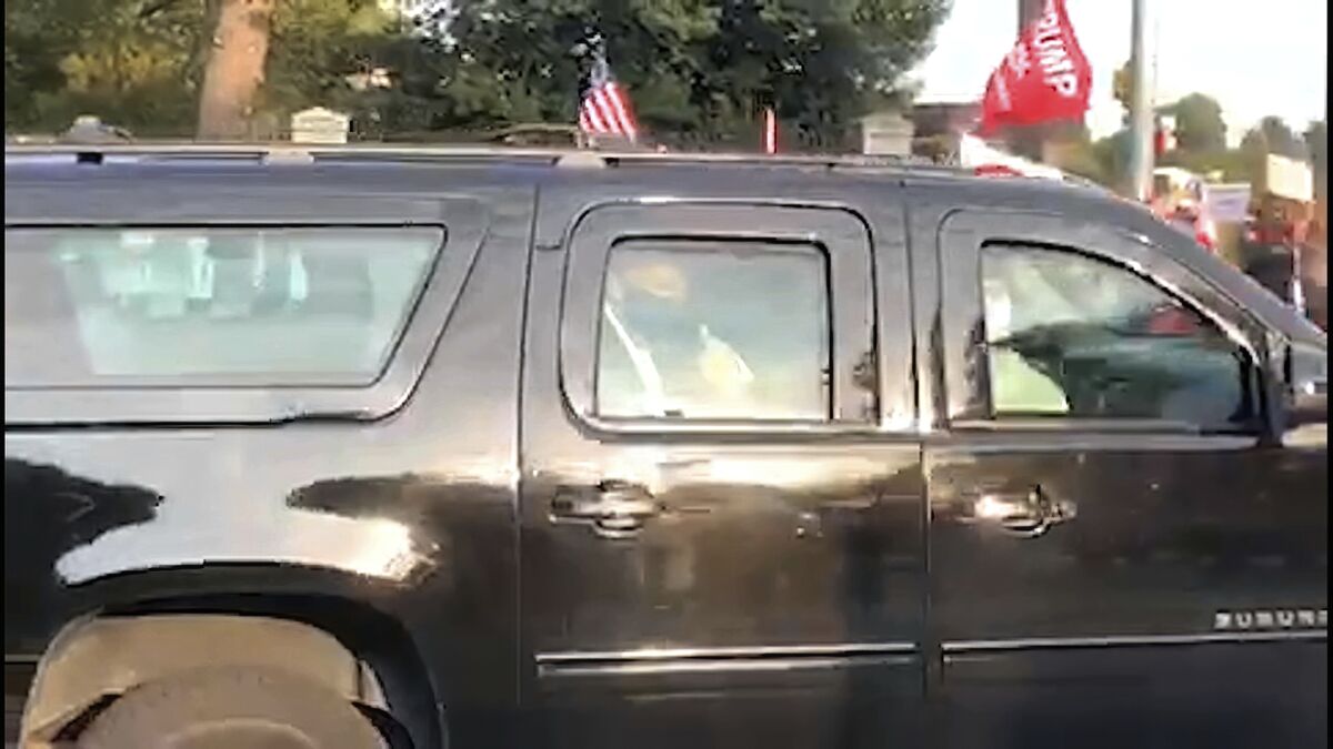 President Trump rides past supporters gathered outside Walter Reed National Military Medical Center.