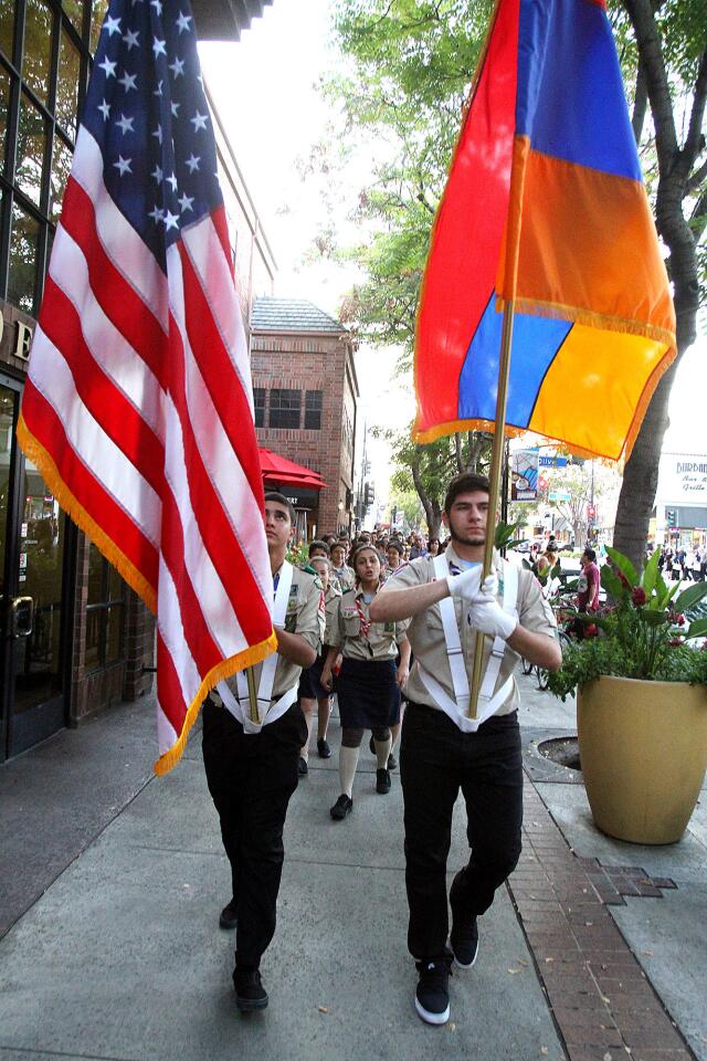 The American Flag, and the Armenian Flag are carried at the front of a procession in Burbank where local Armenians walked from Burbank City Hall to the Burbank Youth Center to commemorate the Armenian Genocide on Tuesday, April 22, 2014.