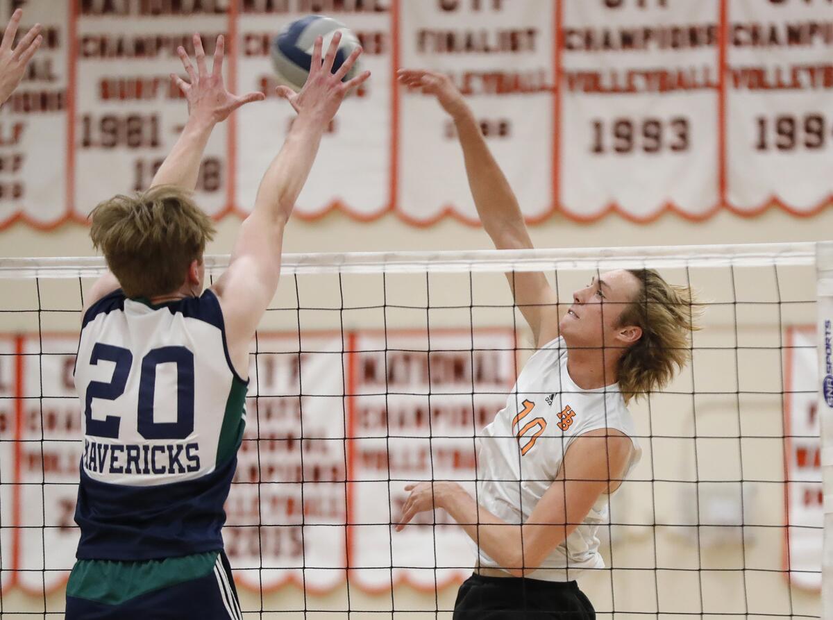 Huntington Beach's Liam Phinizy hits the ball cross-court against Carlsbad La Costa Canyon on June 8.