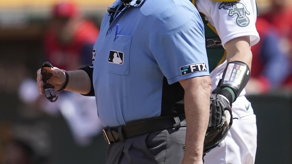 Plate ump leaves A's-Angels game after getting hit twice - The San