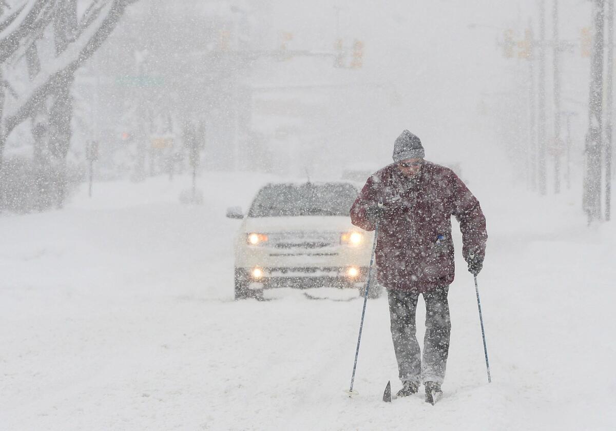 Timothy Gigone, 51, skis along a road in Erie, Pa., on Saturday.
