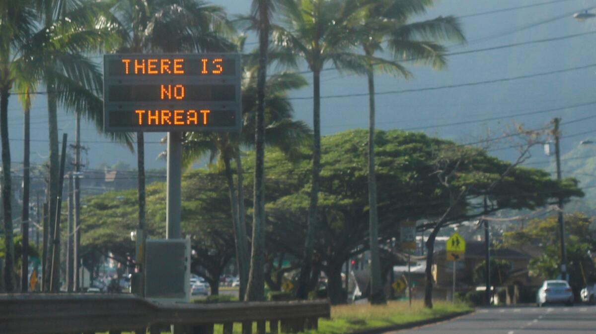 A highway median sign broadcasts a message on Saturday in Kaneohe, Hawaii.