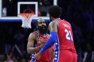 Philadelphia 76ers' James Harden, left, and Joel Embiid celebrate after a basket during the second half of an NBA basketball game against the Los Angeles Clippers, Friday, Dec. 23, 2022, in Philadelphia. (AP Photo/Matt Slocum)