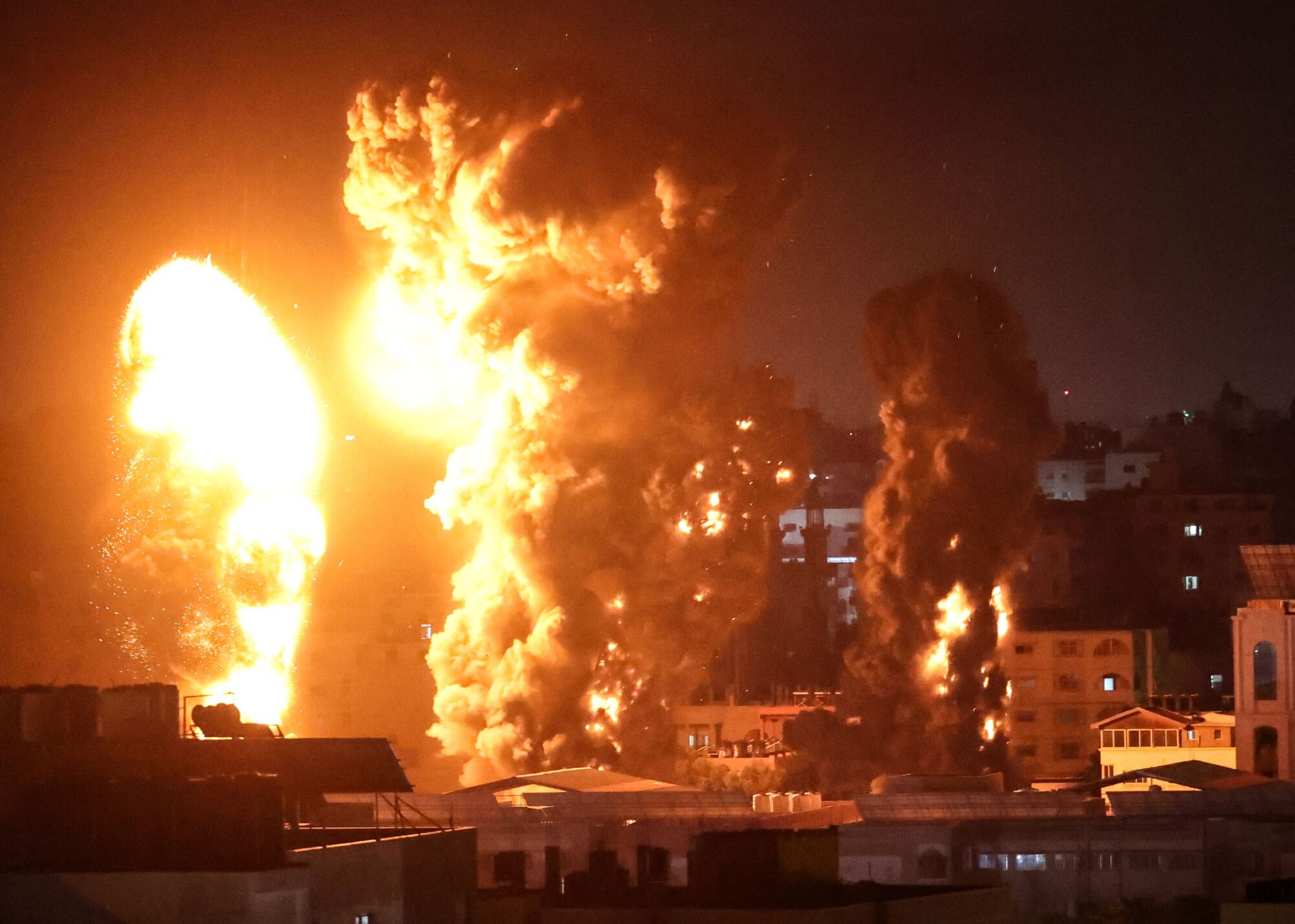 Fire and smoke rise above buildings in Gaza City 