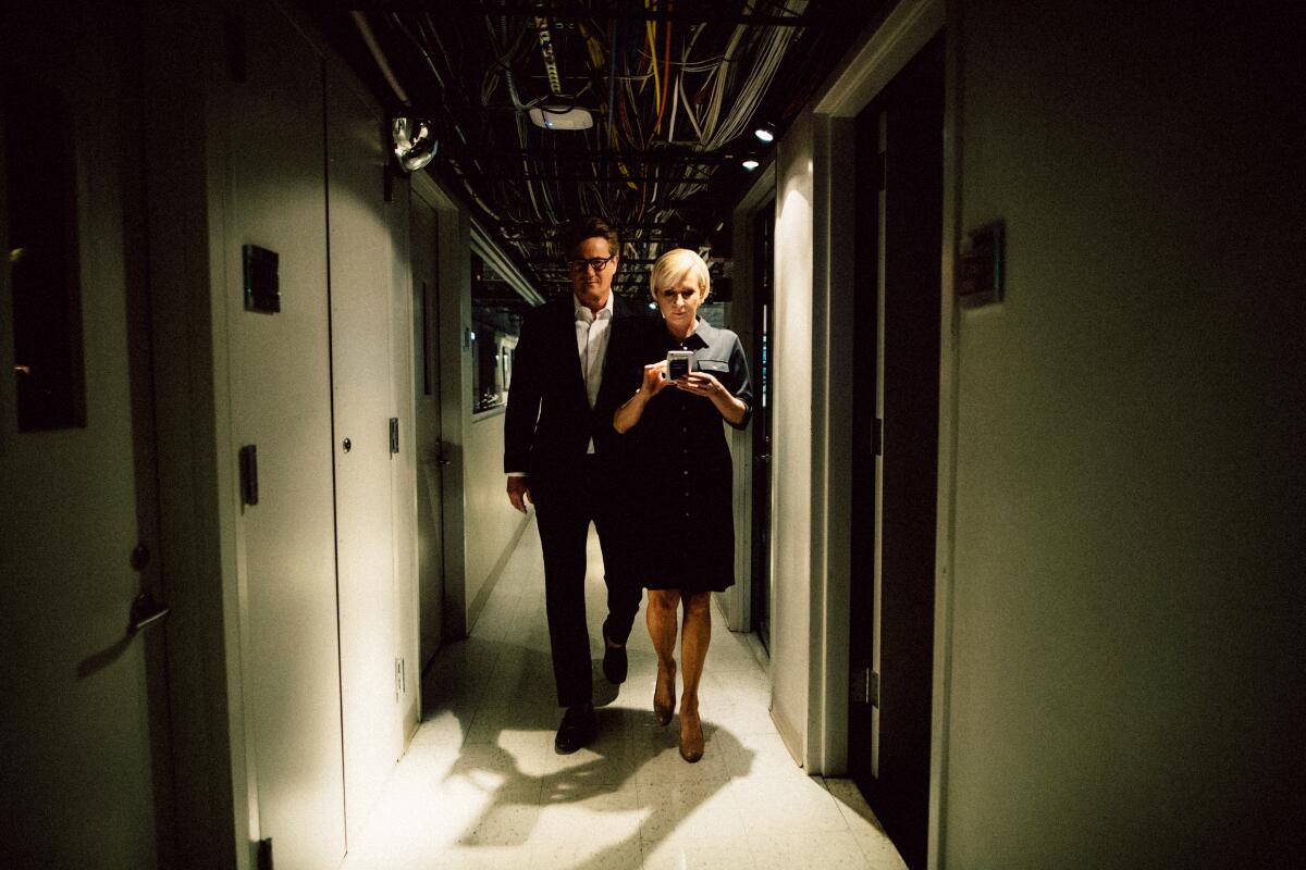 (L-R) Co-hosts Joe Scarborough and Mika Brzezinski in a behind the scenes photo from the show "Morning Joe" on MSNBC. 