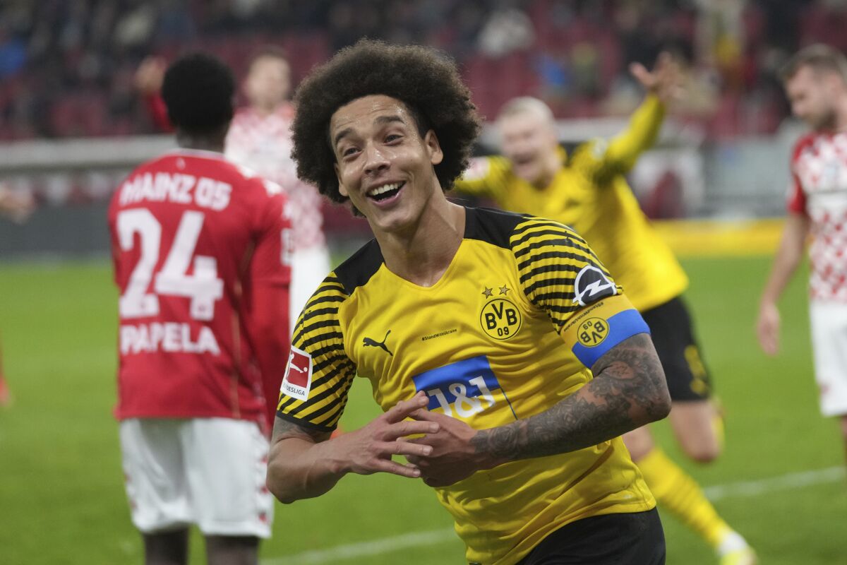 Dortmund's Axel Witsel celebrates after scoring the opening goal during a Bundesliga soccer match between FSV Mainz 05 and Borussia Dortmund at the Mewa Arena in Mainz, Germany, Wednesday, March 16, 2022. (AP Photo/Michael Probst)