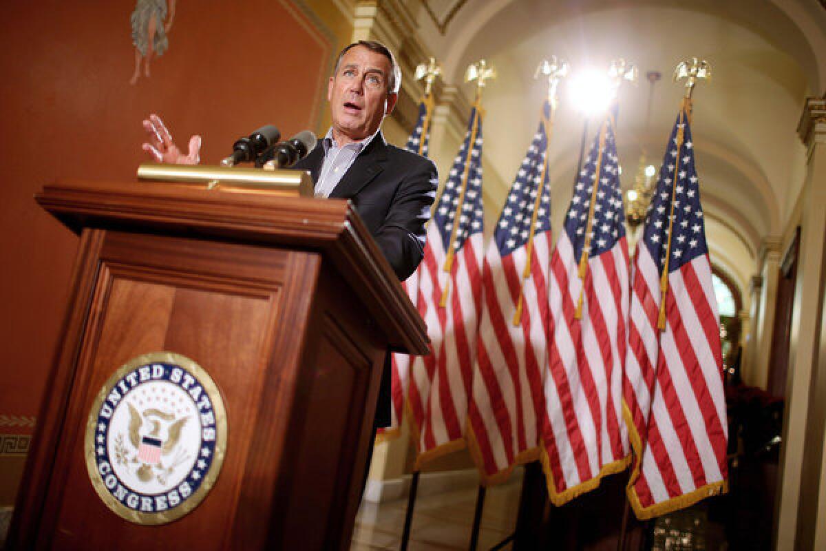 Speaker of the House John Boehner (R-Ohio) talks with reporters outside his office in the Capitol in Washington, D.C.