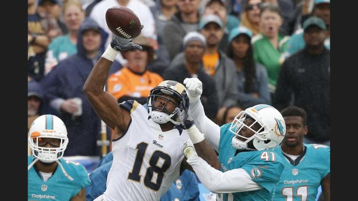 Rams receiver Kenny Britt battles Dolphins cornerback Byron Maxwell for a pass that fell incomplete during the second quarter. To see more images from the game, click on the photo above.