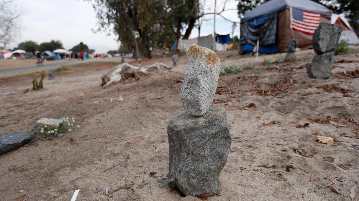 The "Rock Memorial" at a homeless encampment along the Santa Ana River Trail in Anaheim on Nov. 29. Homeless Persons' Memorial Day will be held Dec. 21.