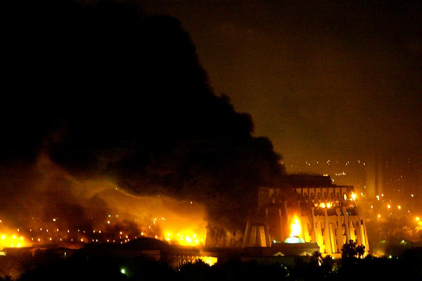 061908.MN.0321.Baghdad.4.CMC...BAGHDAD, IRAQ - MARCH 20, 2003 - On the third night of the U.S. war on Iraq, heavy bombing took place in the area of the Presidential Compound in central Baghdad. Dozens of explosions rocked the area, as smoke and fire filled the night sky. The Special Security headquarters was one of the heaviest hit.