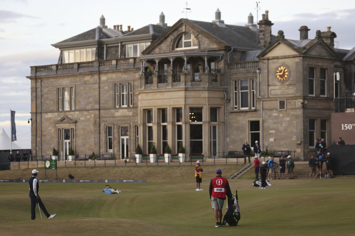 Tiger Woods of the US on the 18th hole during the first round of the British Open golf championship on the Old Course at St. Andrews, Scotland, Thursday, July 14, 2022. The Open Championship returns to the home of golf on July 14-17, 2022, to celebrate the 150th edition of the sport's oldest championship, which dates to 1860 and was first played at St. Andrews in 1873. (AP Photo/Peter Morrison)