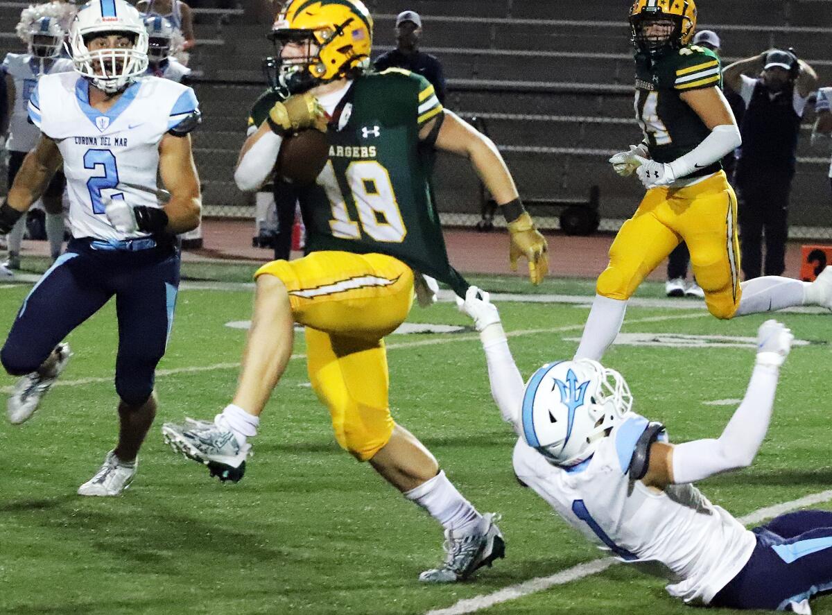 Edison's Julius Gillick (18) runs for yardage.