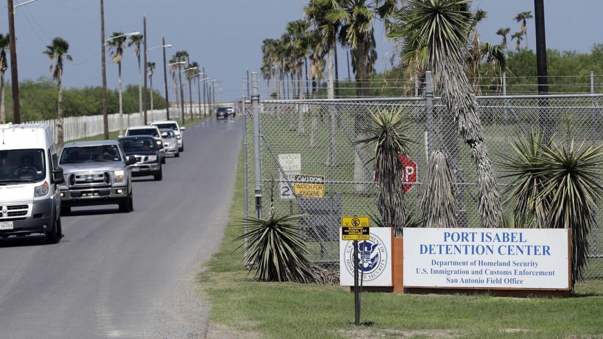 Vehicles leave the Port Isabel Detention Center, which holds detainees of U.S. Immigration and Customs Enforcement in Los Fresnos, Texas.