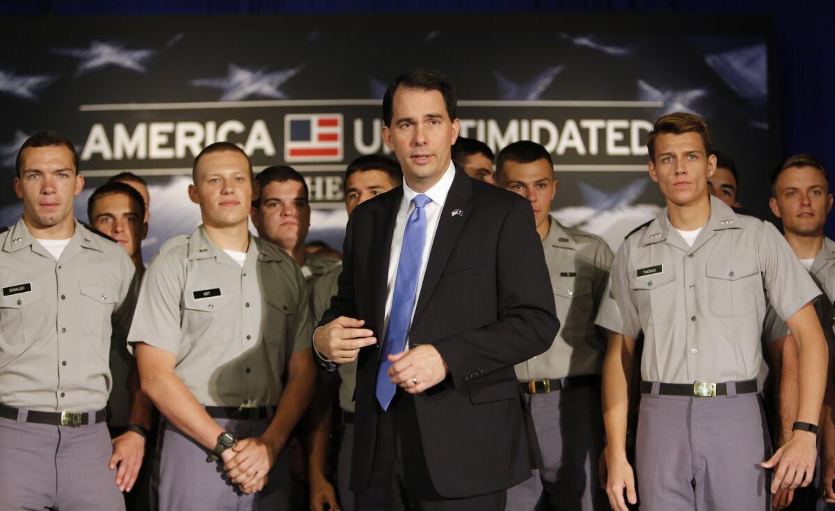 Wisconsin governor and Republican presidential candidate Scott Walker stands with cadets Friday after giving a foreign policy speech at the Citadel in Charleston, S.C.