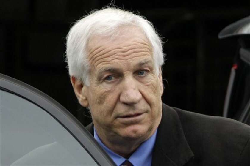 FILE - In this June 18, 2012 file photo, former Penn State University assistant football coach Jerry Sandusky leaves the Centre County Courthouse in Bellefonte, Pa. Former FBI director Louis Freeh, who led a Penn State-funded investigation into the university's handling of molestation allegations against Sandusky, is scheduled to release his highly anticipated report Thursday, July 12, 2012. (AP Photo/Gene J. Puskar, File)