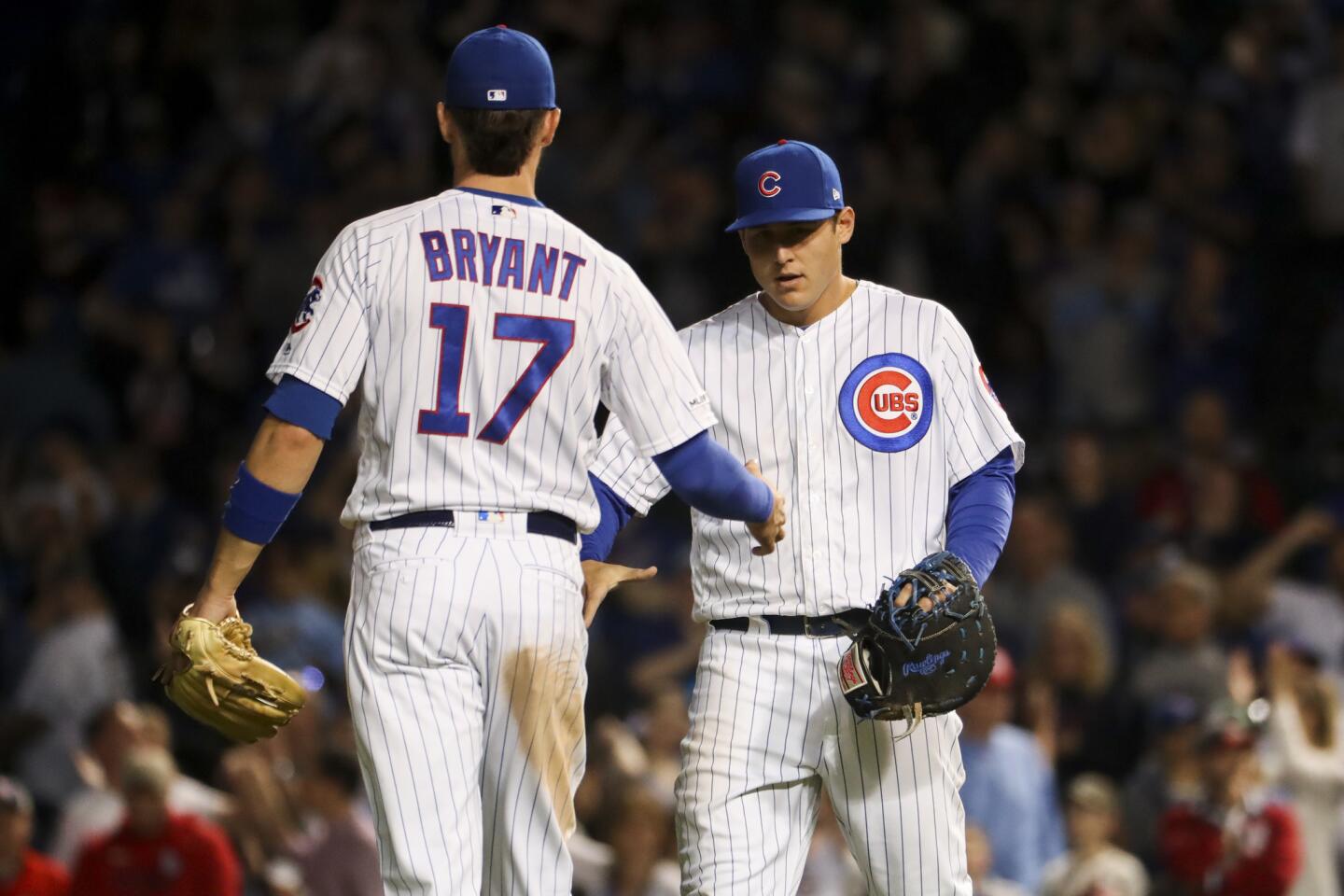 Cubs third baseman Kris Bryant celebrates with teammate Anthony Rizzo after the Cubs defeated the Cardinals, 13-5, on May 5, 2019, at Wrigley Field.