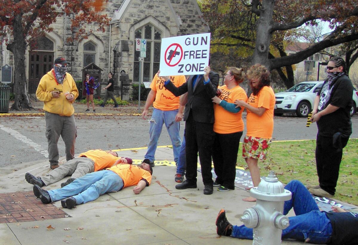 Gun-rights activists held a mock shooting outside the University of Texas in Austin to protest gun-free zones. Counterprotesters condemned the event as in poor taste.